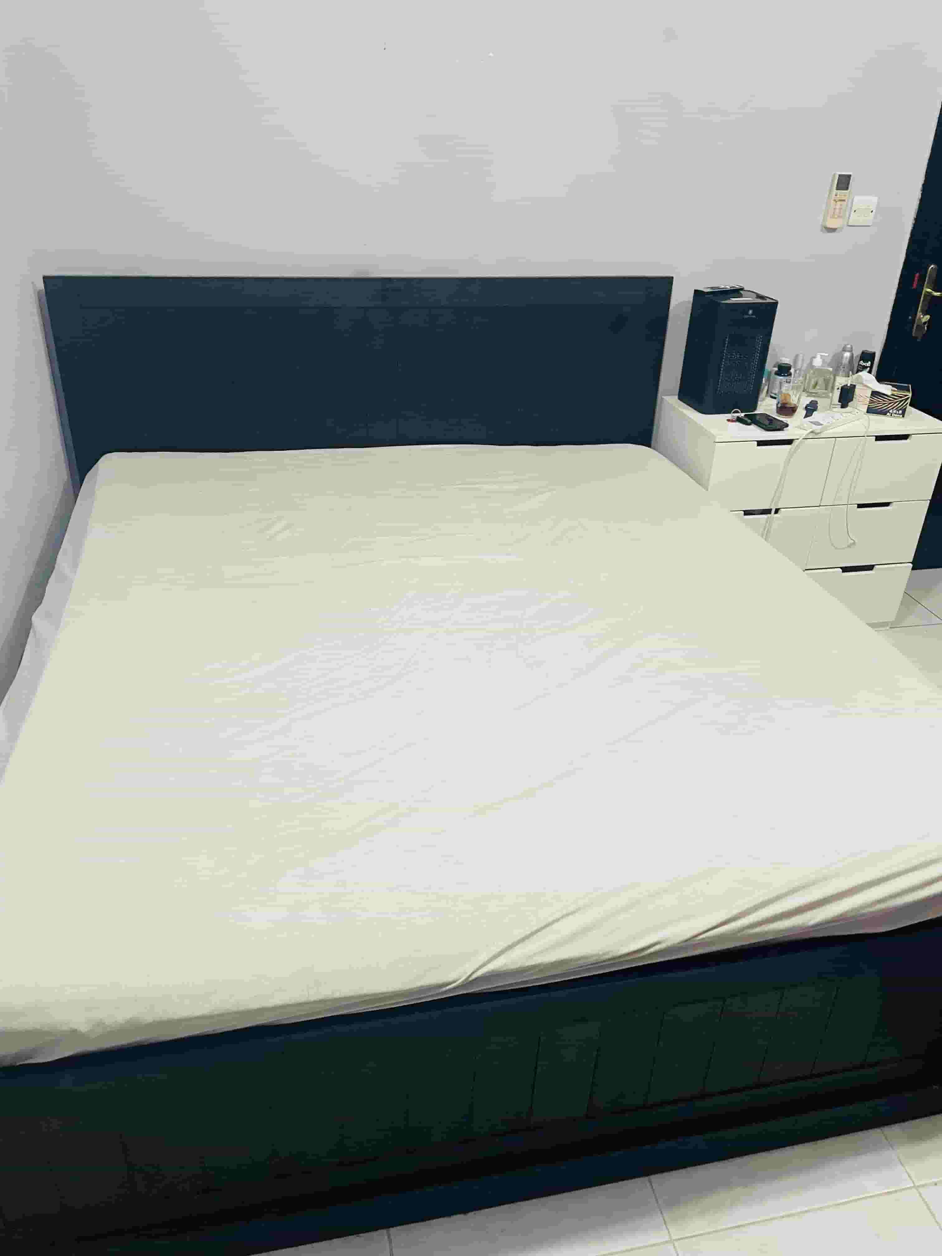 A large bed with a medical mattress in excellent condition