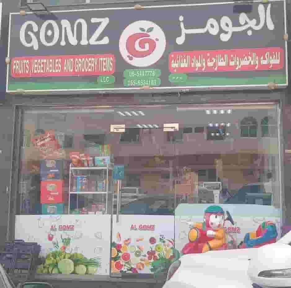 A shop selling fruit, vegetables and grocery supplies