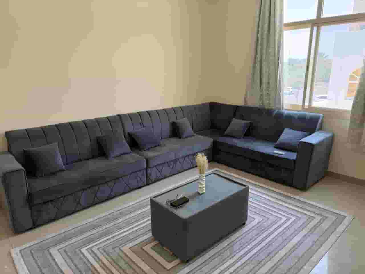 For rent an apartment with a room and a hall and furniture for sale in Asharej