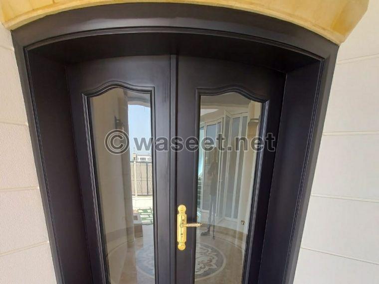 We make wooden and aluminum doors 0
