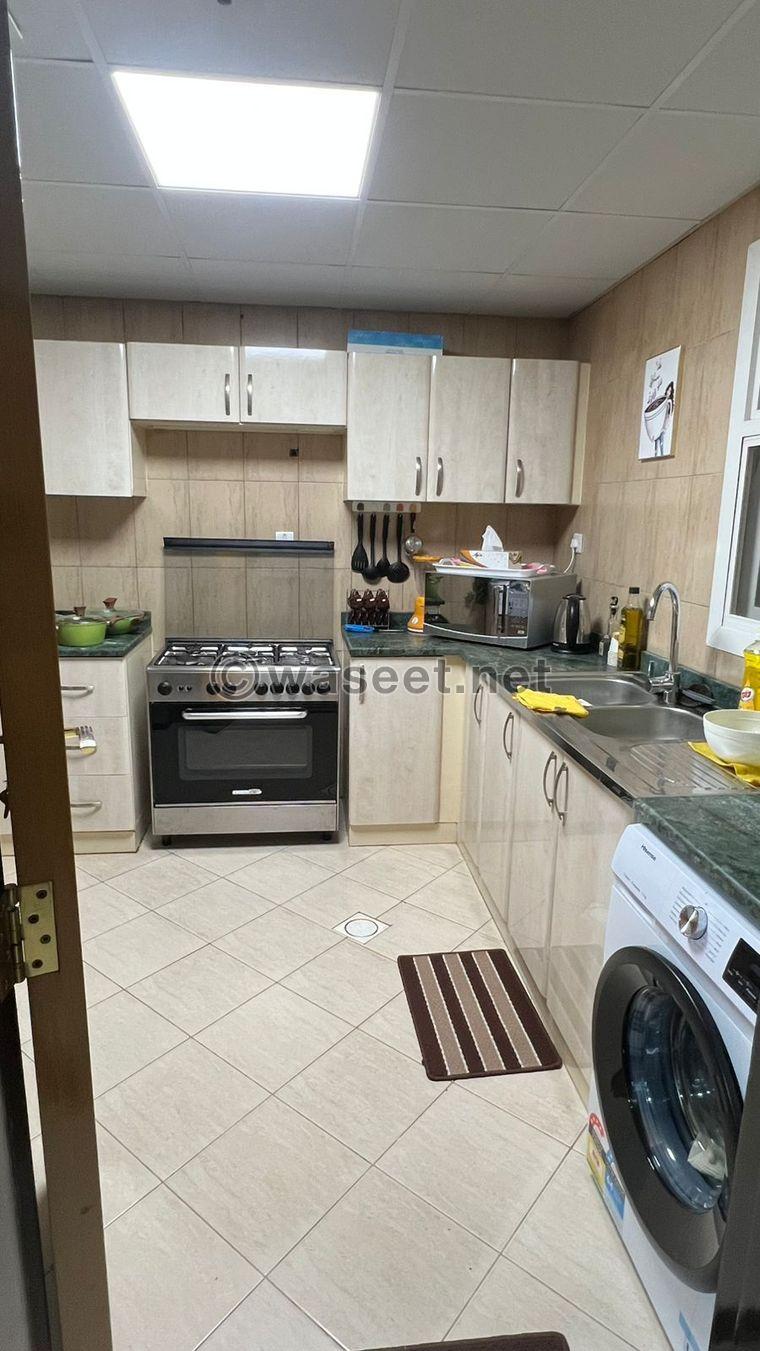 For sale, a one-bedroom apartment in Sharjah with hotel furnishings 2