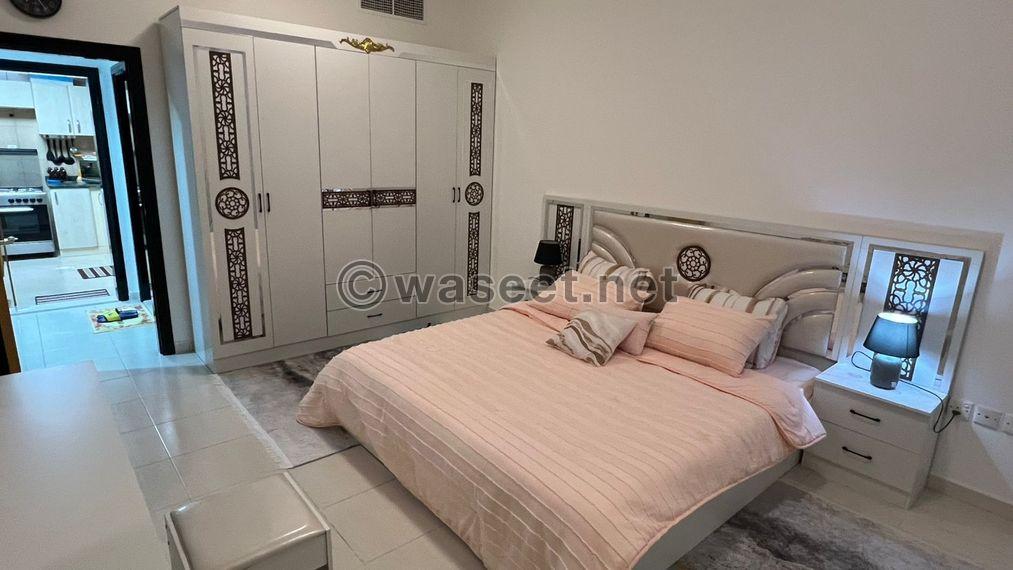 For sale, a one-bedroom apartment in Sharjah with hotel furnishings 1