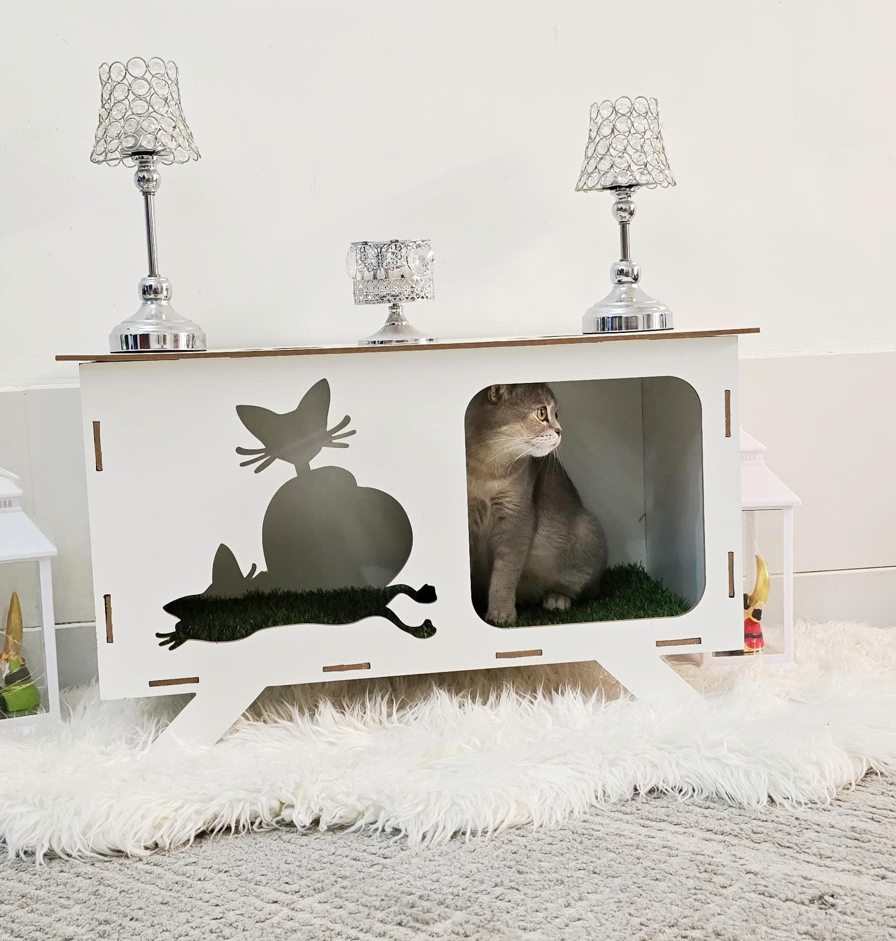 A cat house made of wood 0