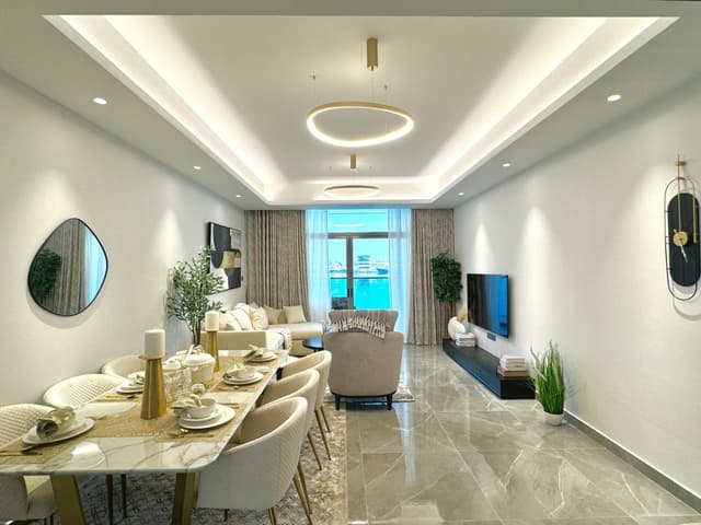 Own your apartment in the most powerful project in Creek Tower Ajman