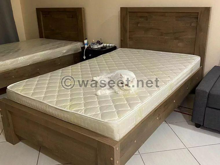Two beds with bedding for sale 0