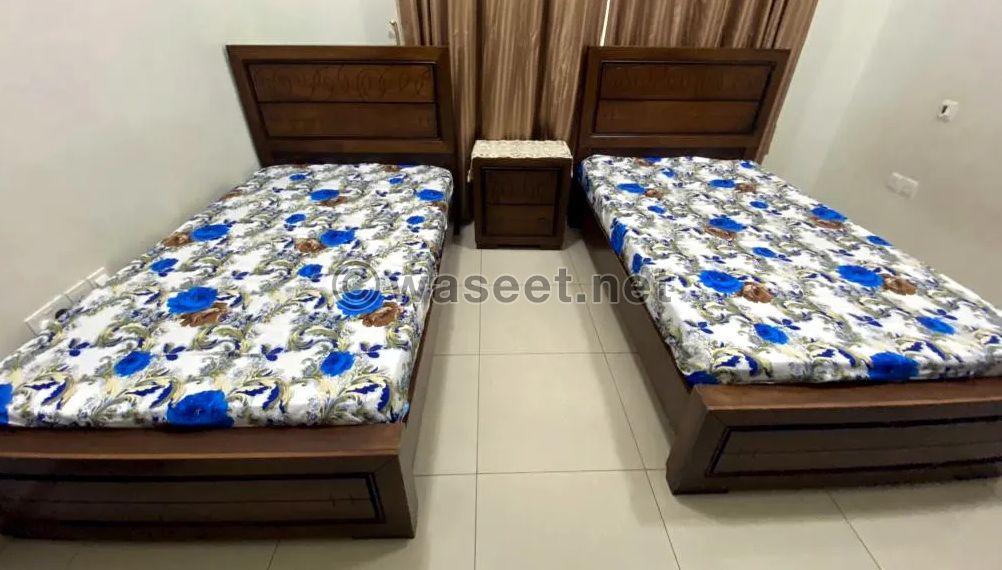 Two beds and a table for sale 0