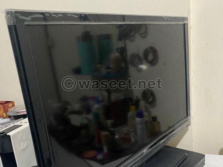 For sale a small 36 inc TV with a stand 1
