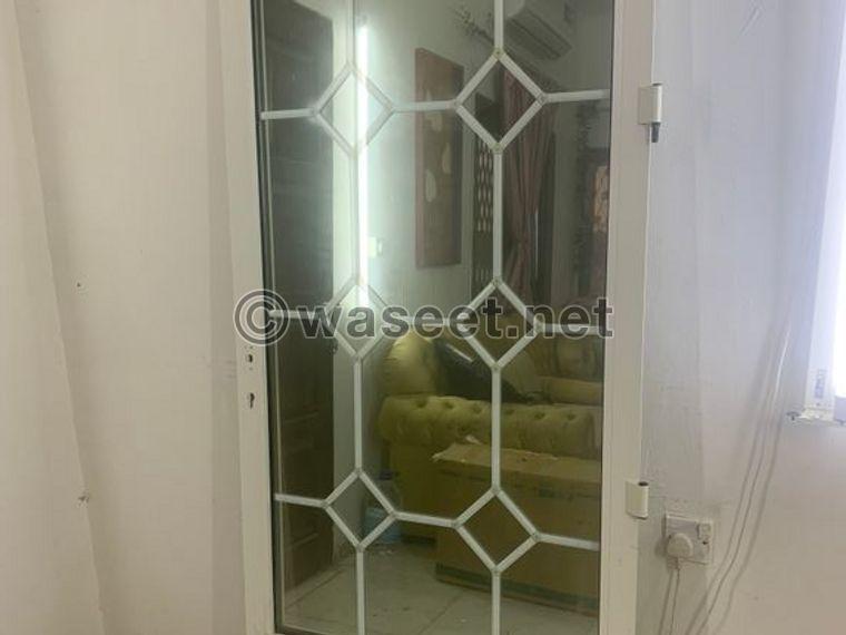 Aluminum door with two-layer glass and frame attached 0