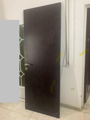 Wooden door in good condition with all frame accessories
