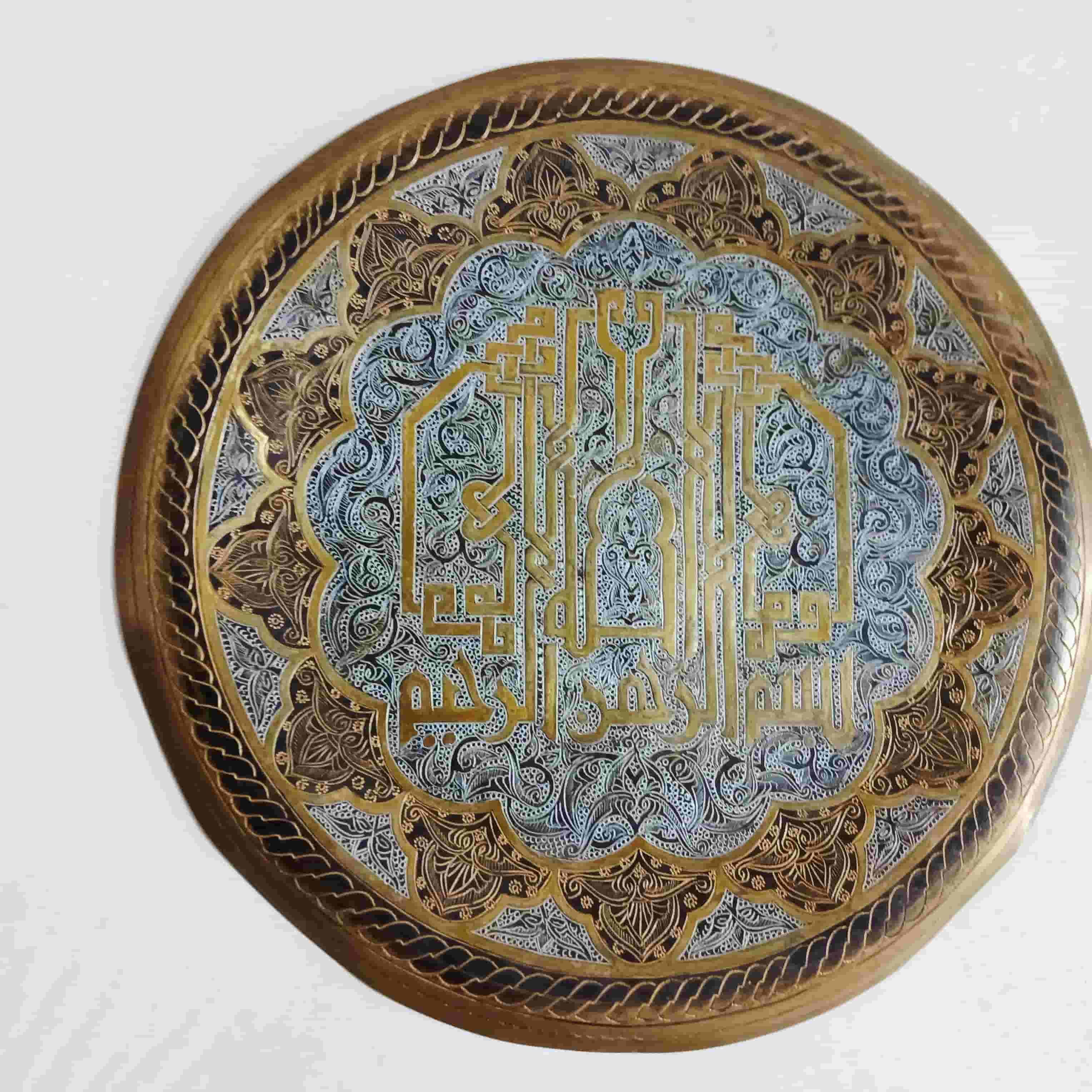 An engraved traditional copper dish   An engraved traditional copper dish